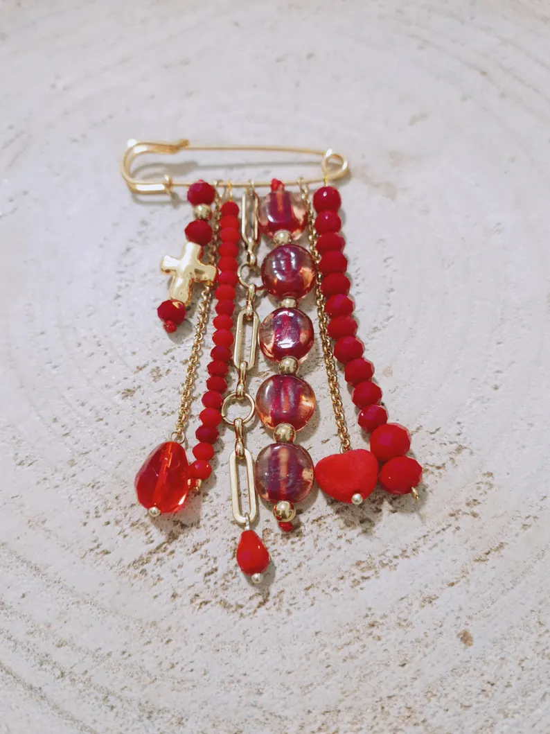 Red fringe brooch